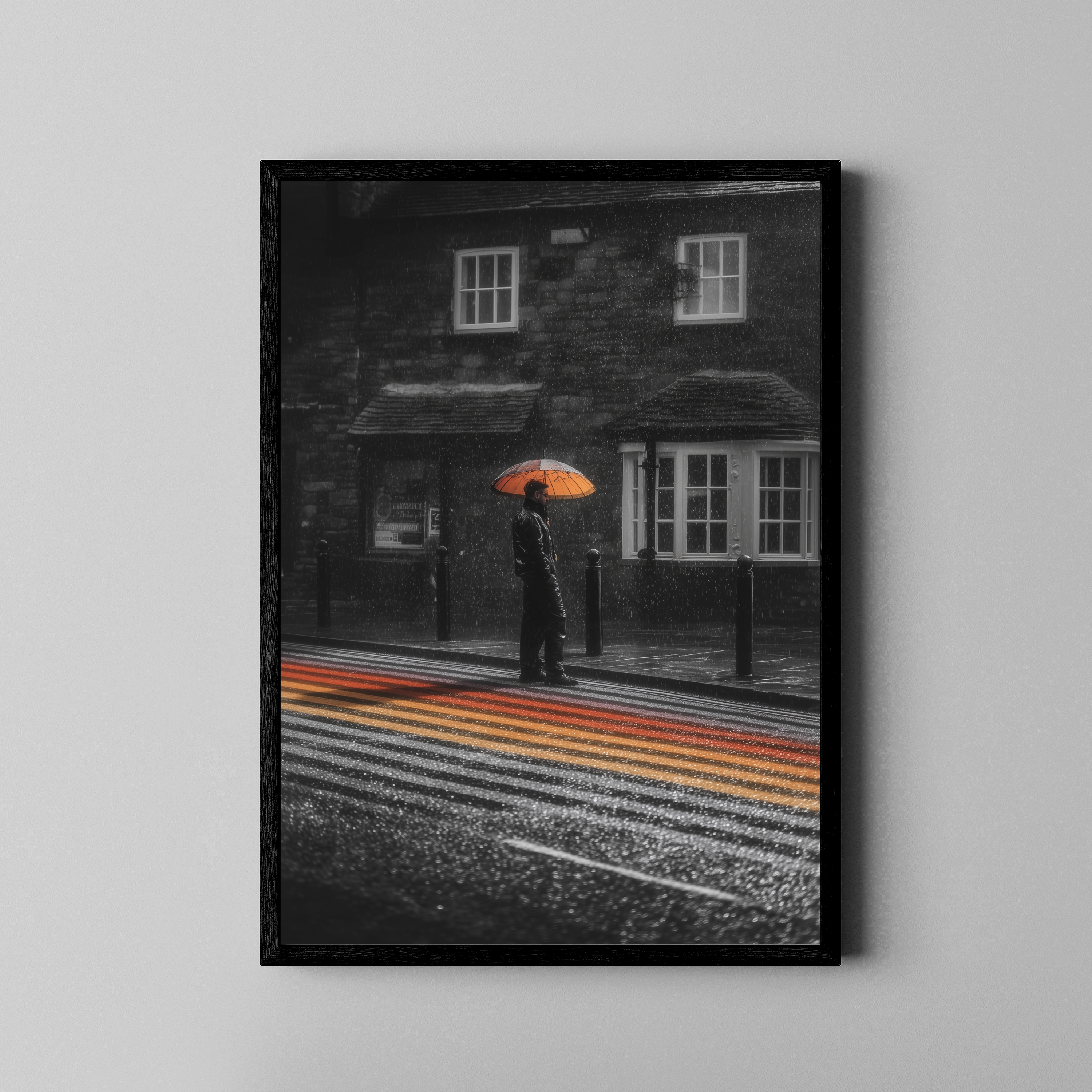 Schwarz-Weiß Fotografie mit orangem Regenschirm und buntem Zebrastreifen im Regen – Poster im schwarzen Rahmen